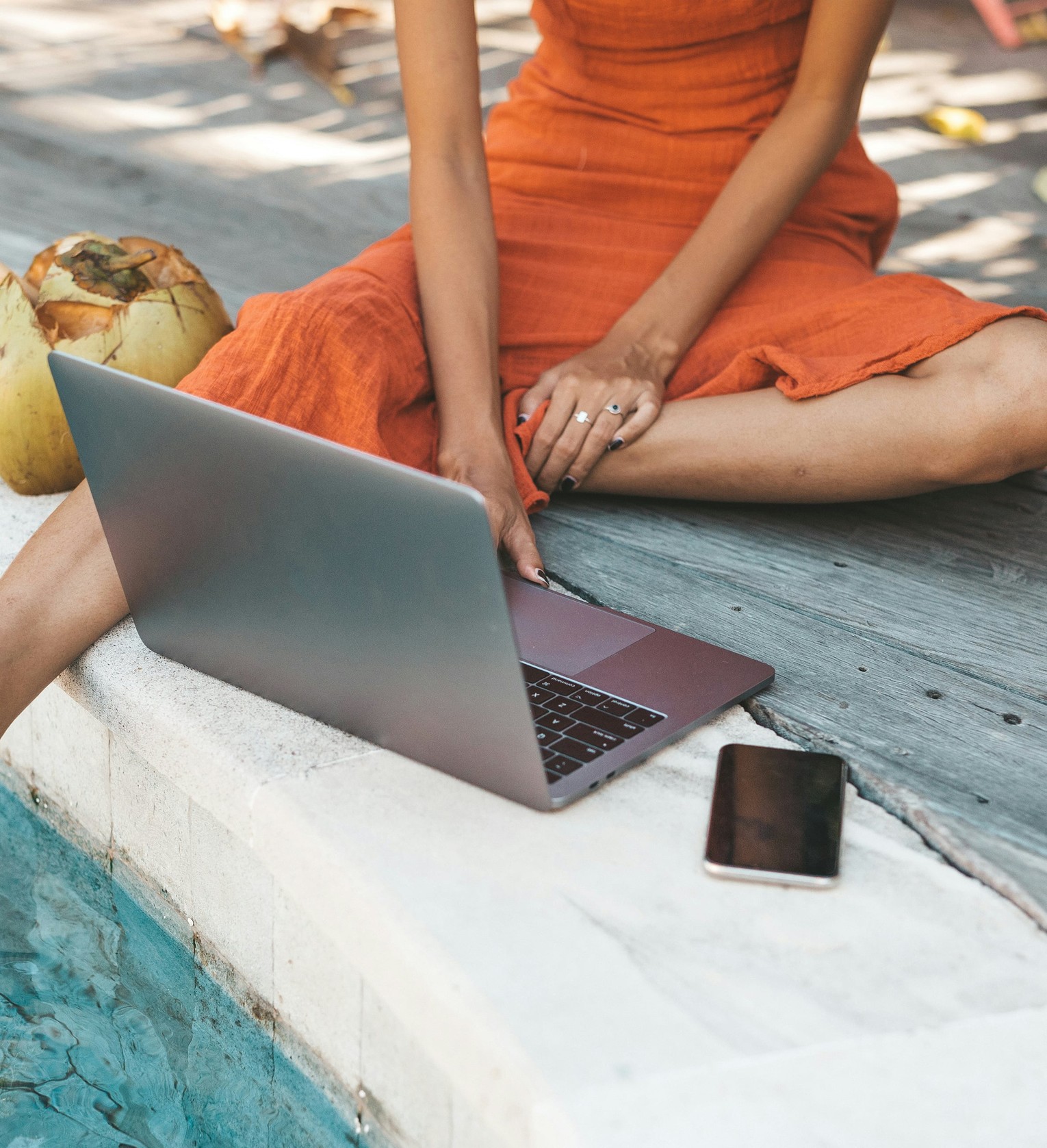 sitting outside on a laptop